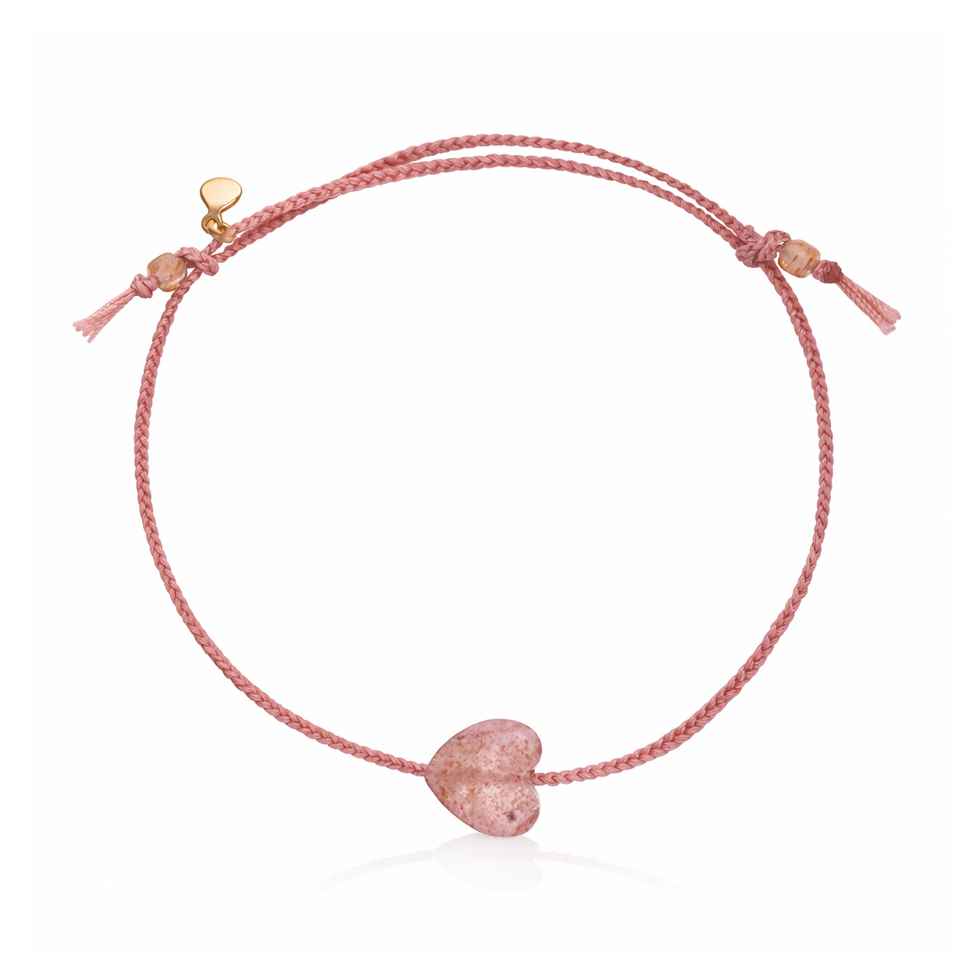 Pink cord bracelet with pink heart charm and knot-tied tassel details