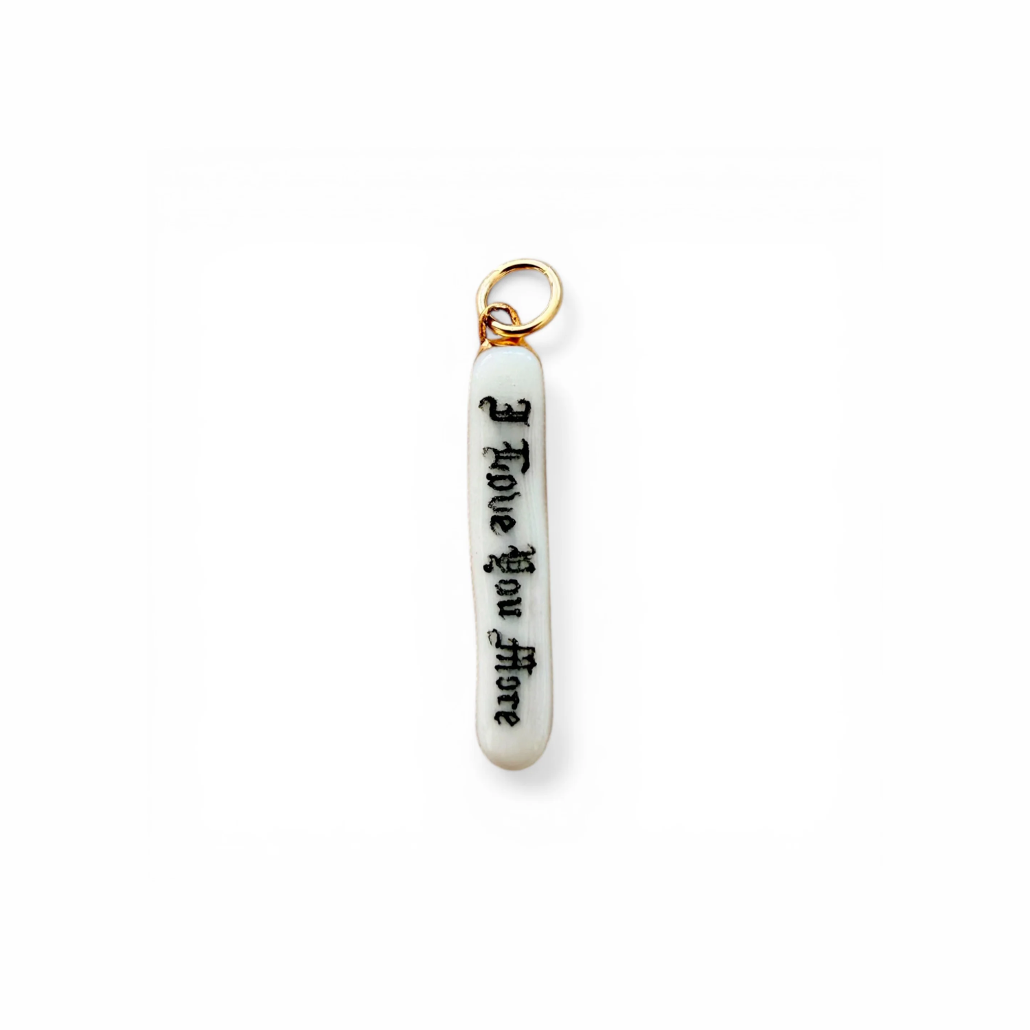 Porcelain charm with gold loop, engraved 'I love you more' script