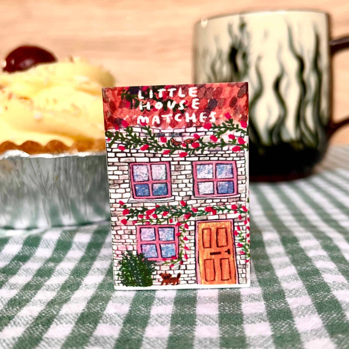 Red and white Little House Matches matchbox with illustrated windows and door
