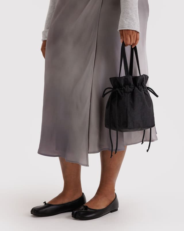 Gray nylon drawstring bag with black drawstring ties and double handles