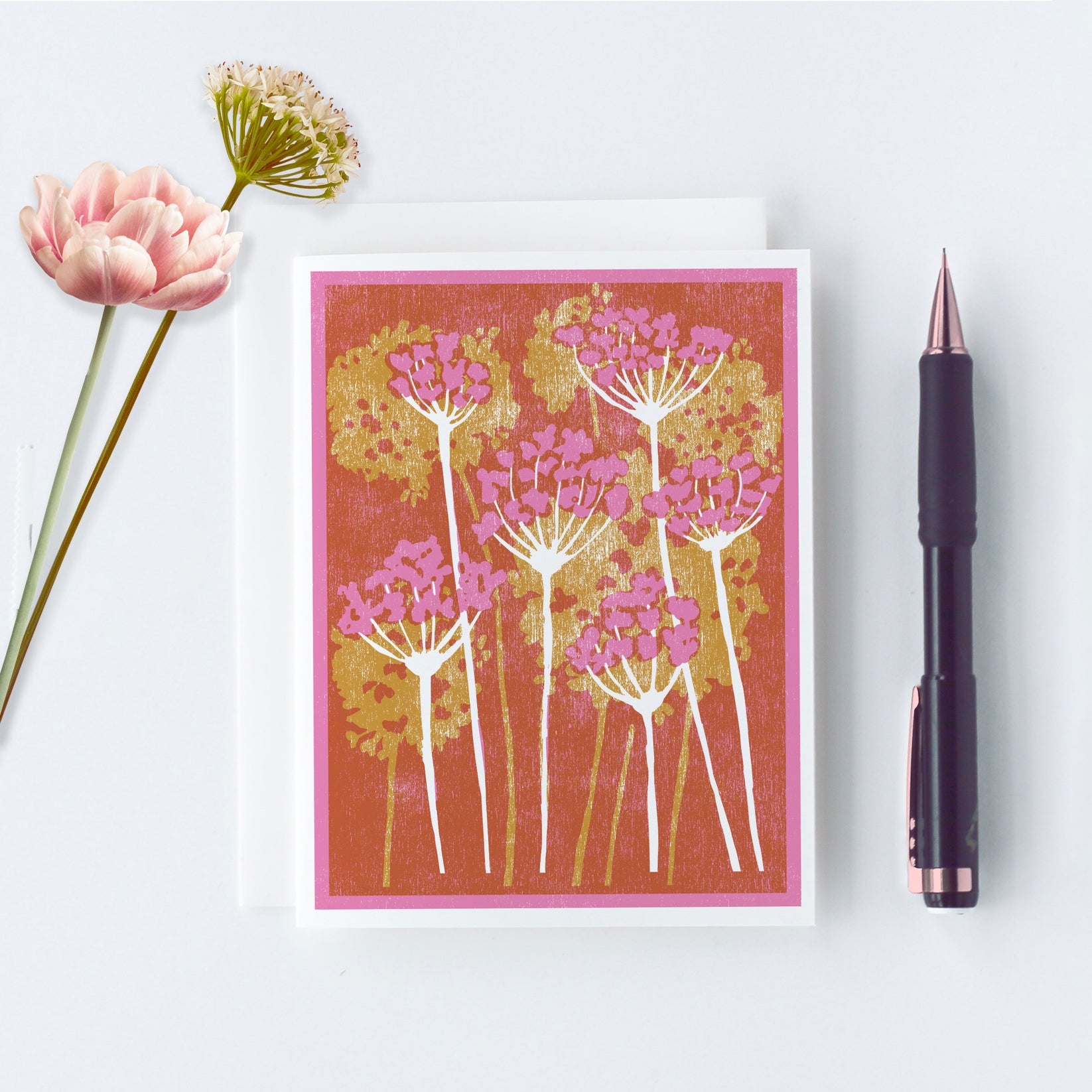 Pink and gold floral letterpress greeting card with dandelion-style blooms