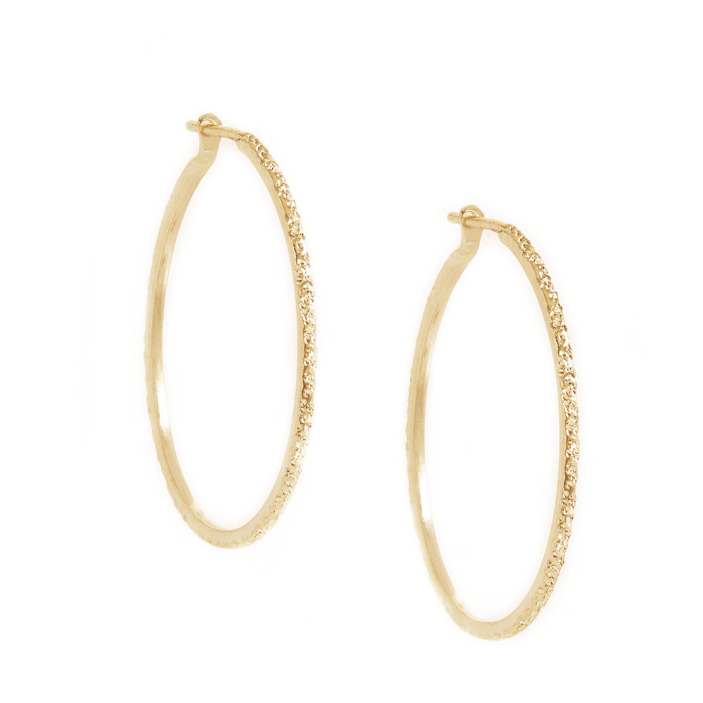 Medium round hoop earrings with diamond-dusted gold vermeil finish
