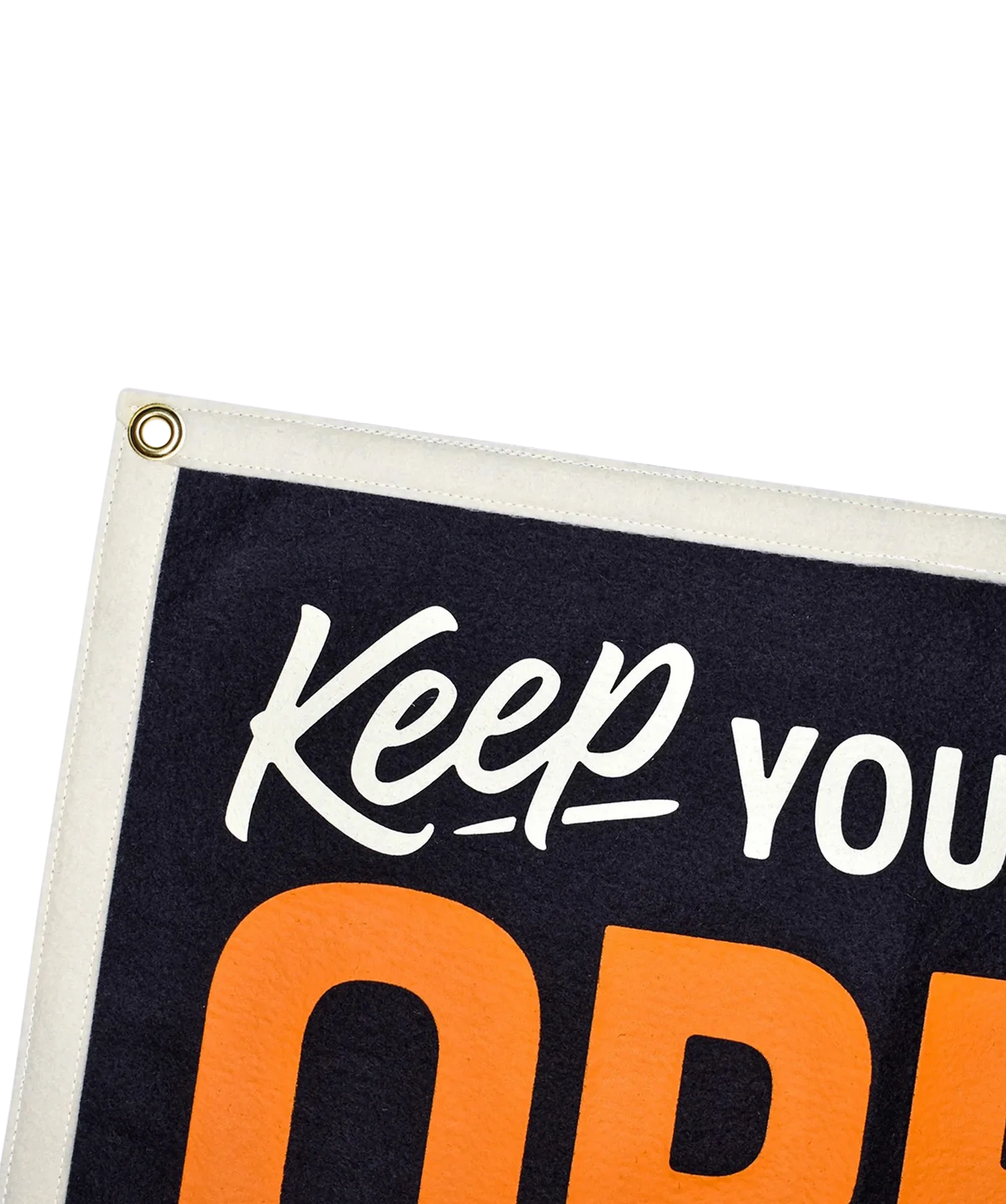 Camp flag close-up with white 'Keep your mind' script and orange 'OPEN', brass grommet