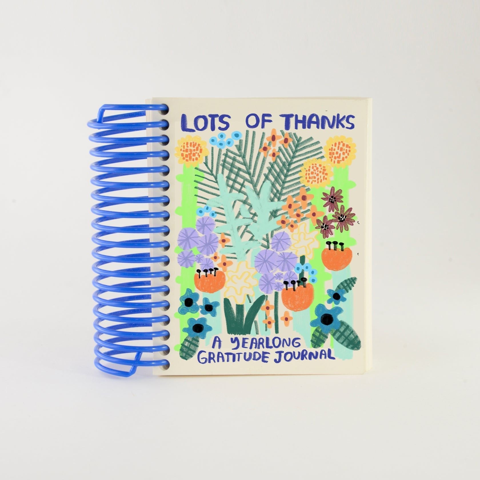 Spiral-bound gratitude journal with colorful floral cover and "Lots of Thanks" title