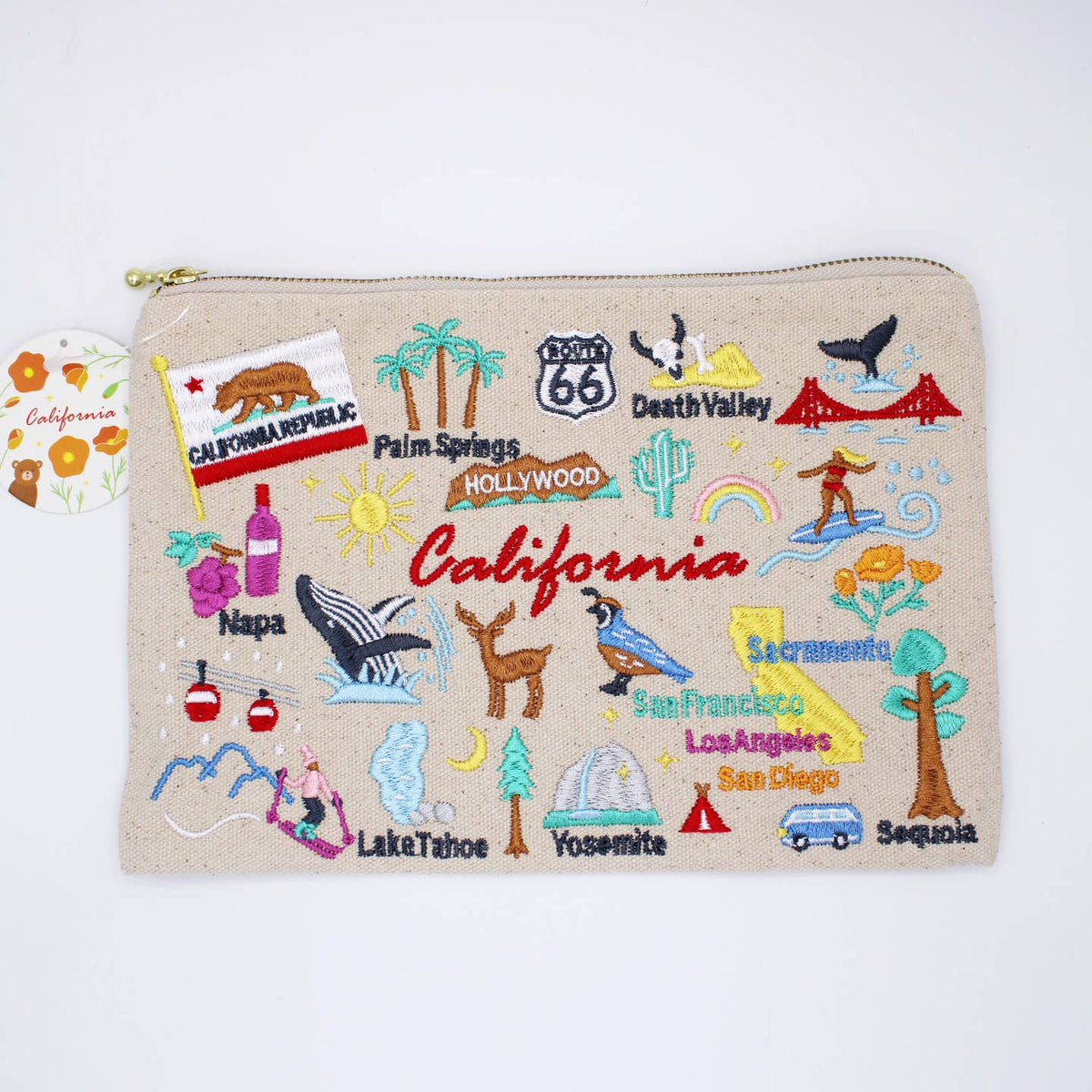 Beige zippered pouch with colorful embroidered California landmarks, gold zipper trim