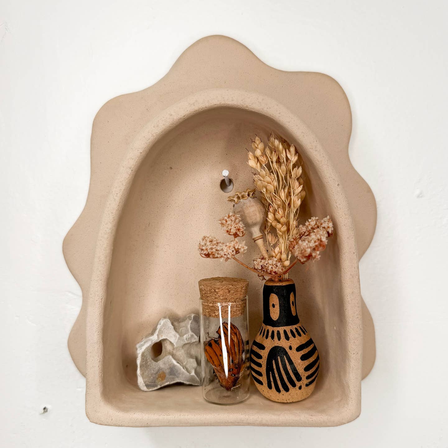Sand cement cloud arch wall shelf with scalloped edges and interior ledge