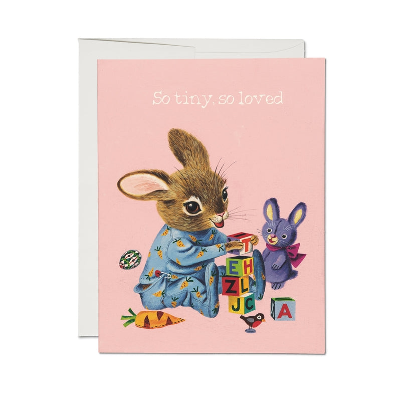 Greeting card with pink cover, woodland animals, and text “So tiny, so loved”