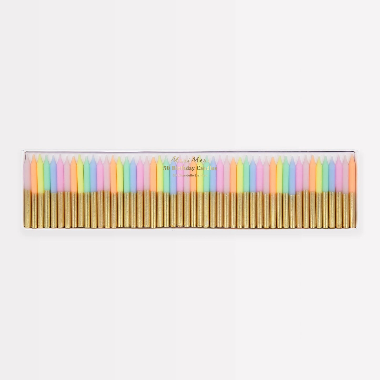 Pastel mini candles arranged in a box with gold stems and multicolor wicks