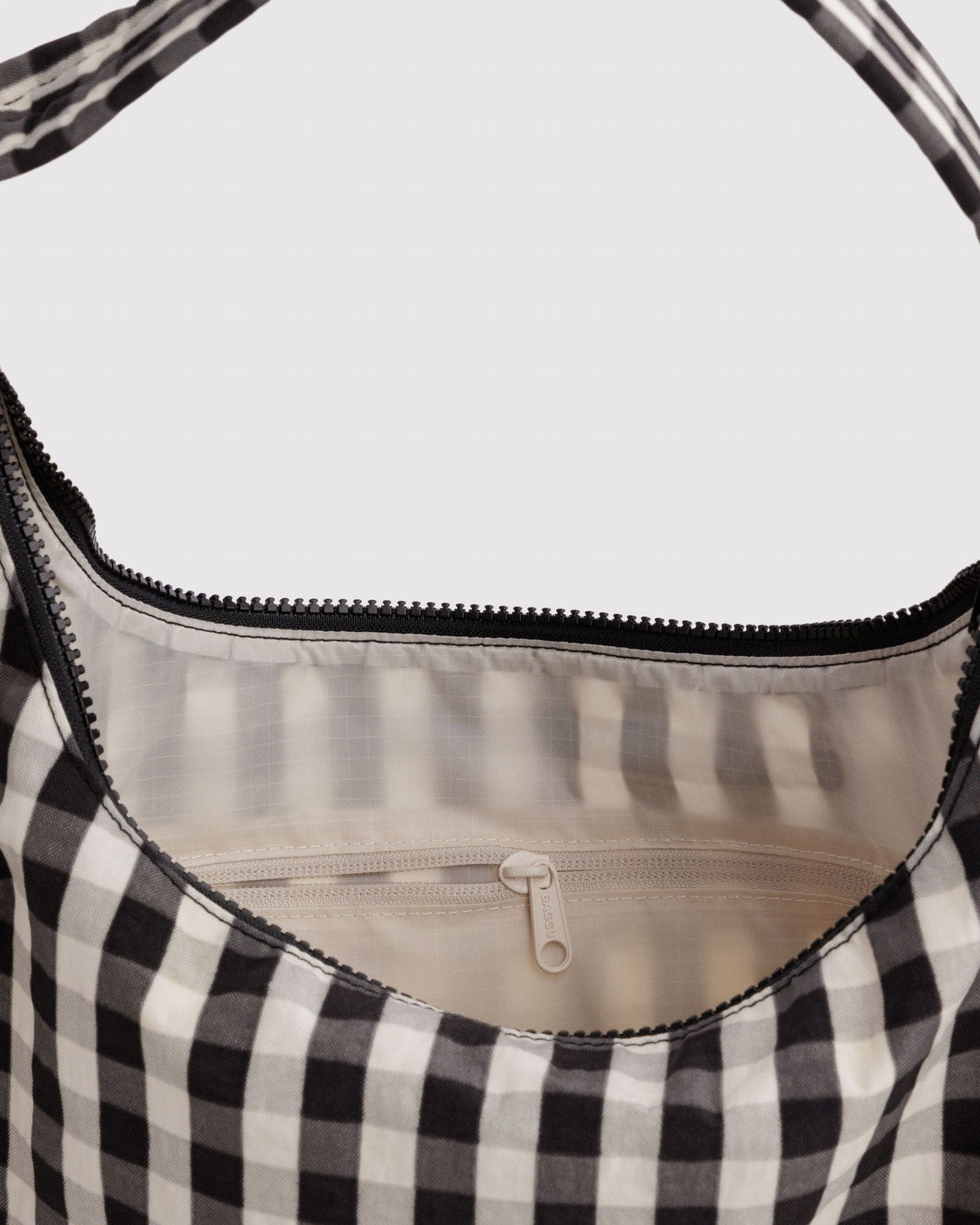 Nylon shoulder bag gingham top with visible inner lining and zip closure detail.