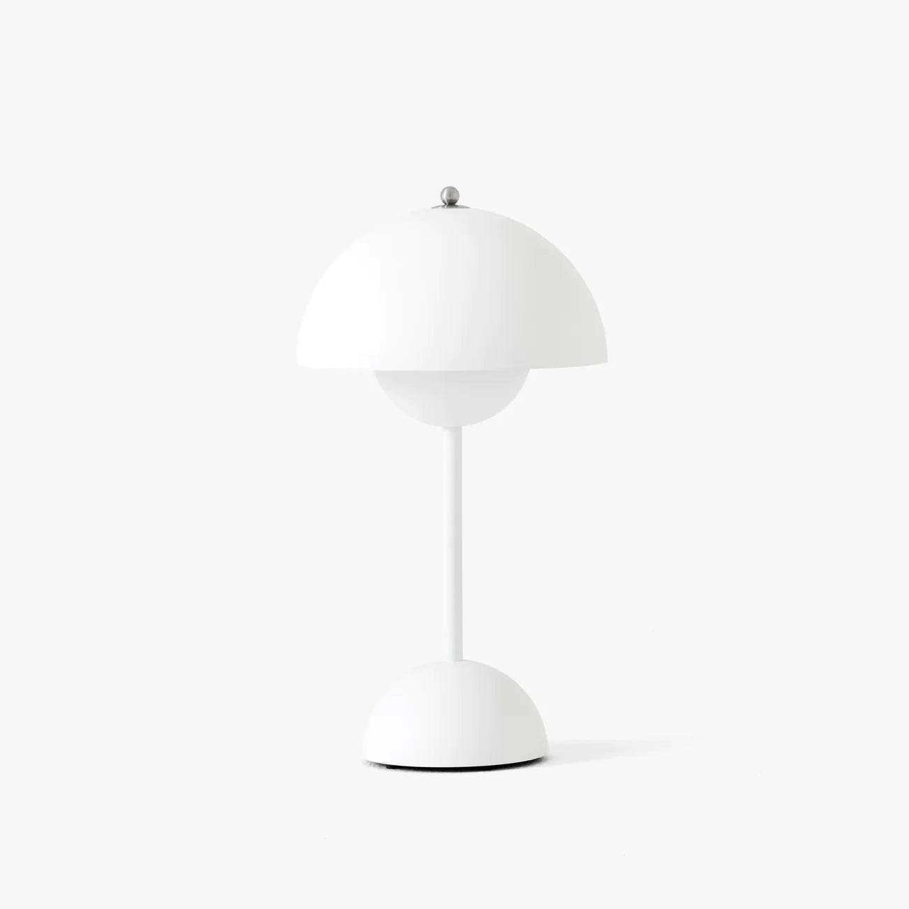 White portable table lamp with dome shade and circular base