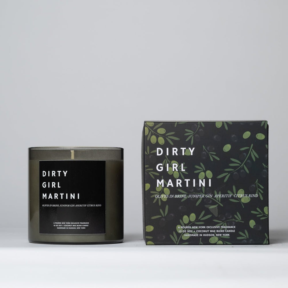 Dirty Girl Martini soy wax candle in dark glass jar with gold lid, printed label