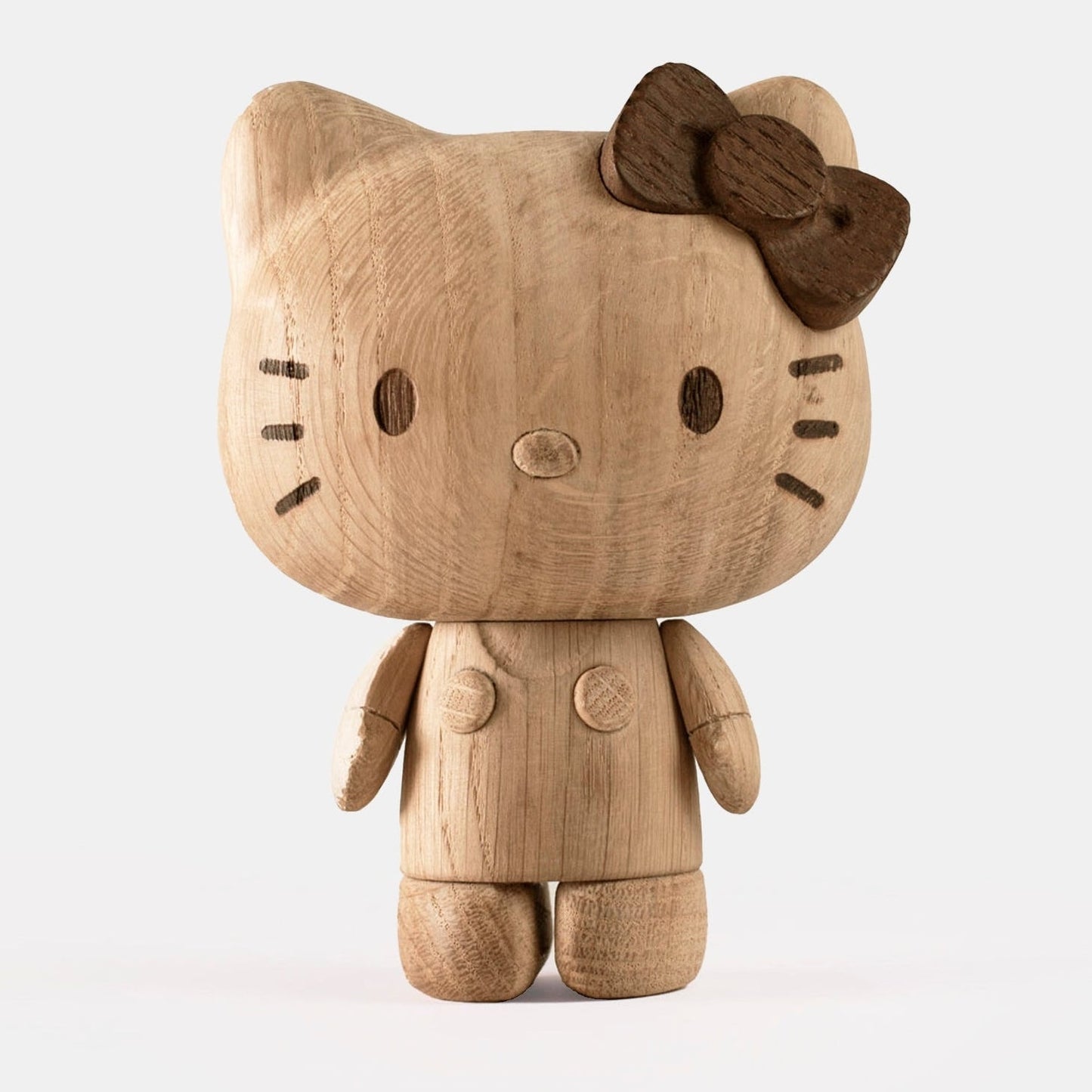 Hello Kitty wooden figurine with bow, front view, carved facial details