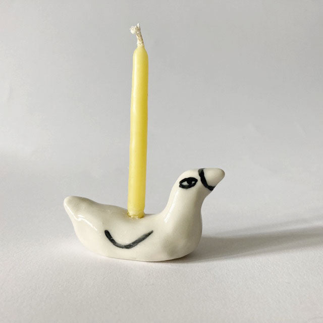 Ceramic duck candle holder topper: yellow candle on white duck with black eye patch