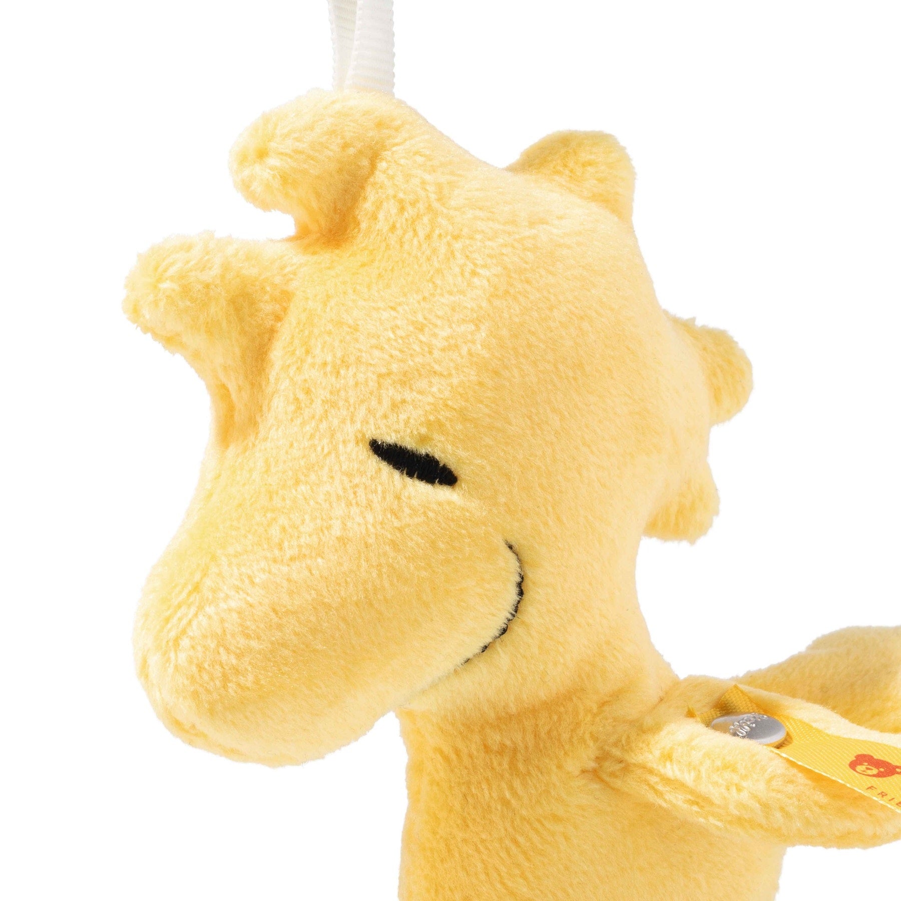 Yellow plush bear bag charm pendant close-up with hanging loop and clasp