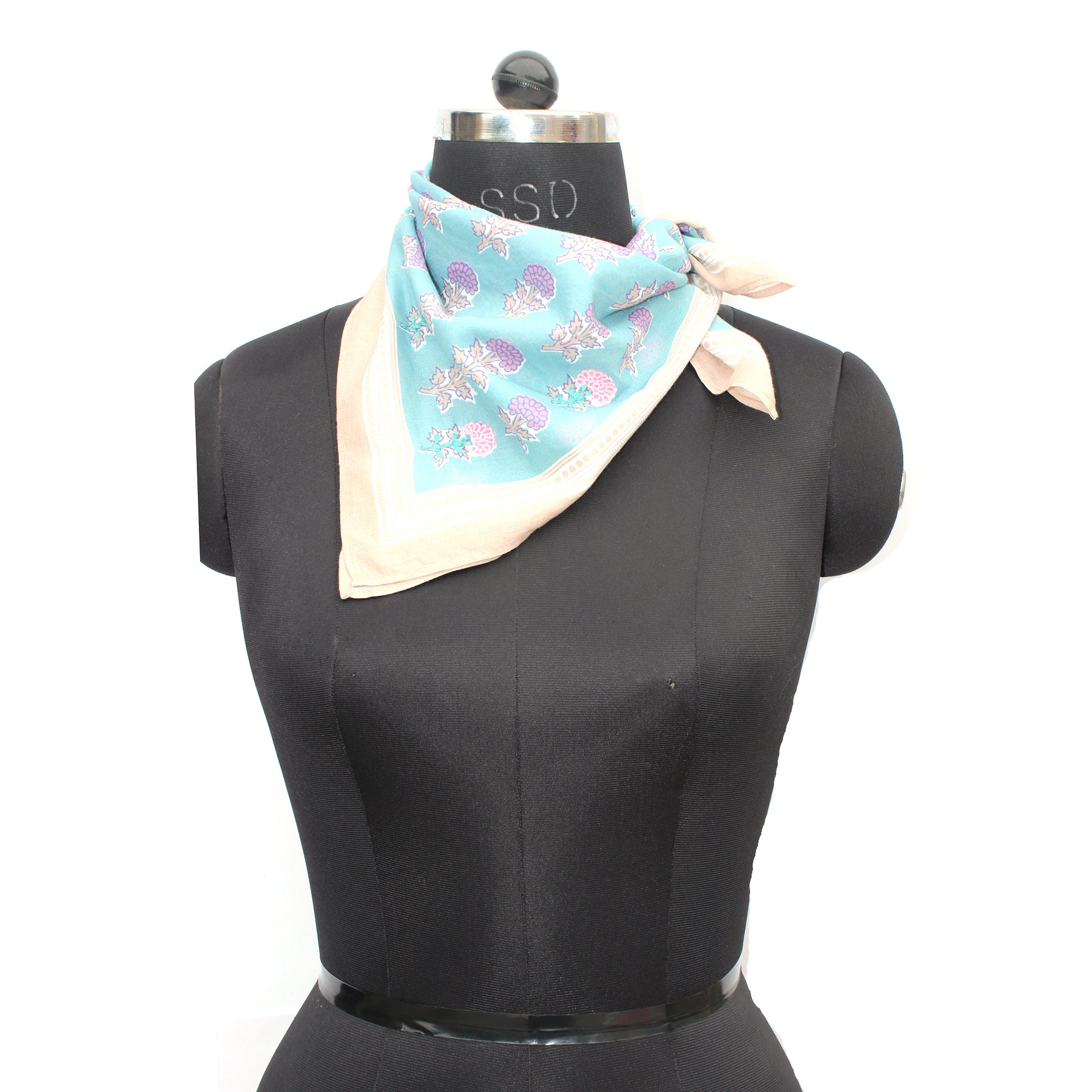Light blue bandana tied on neck, purple and pink floral blockprint