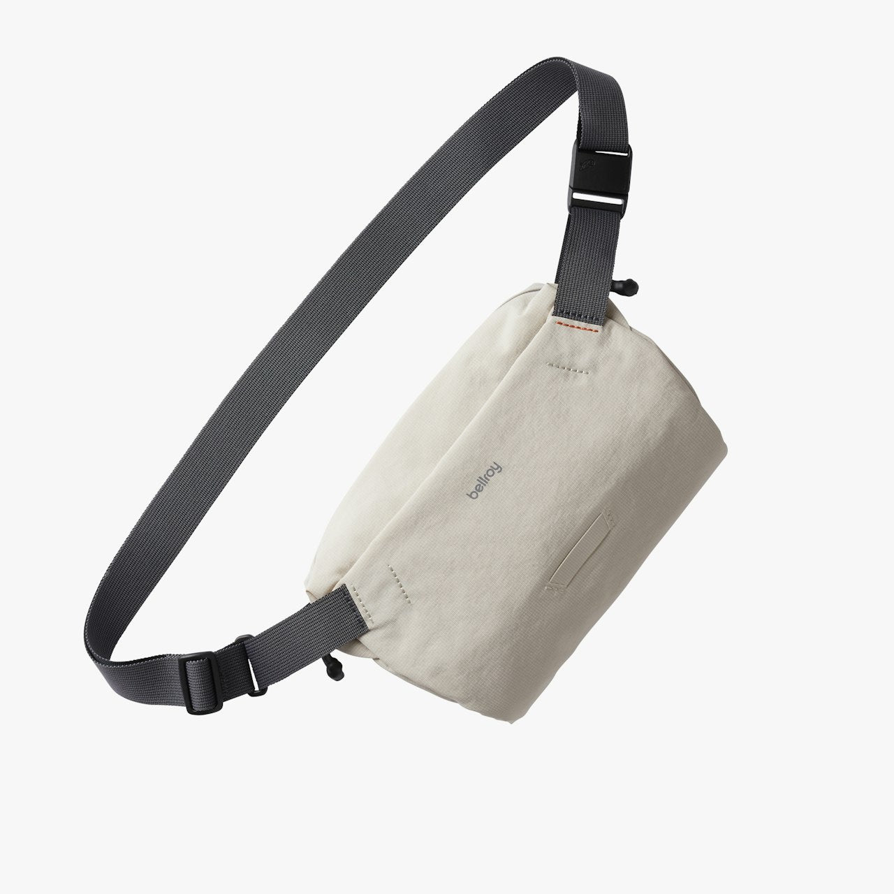 Mini sling bag in off-white with adjustable strap and small front pocket.