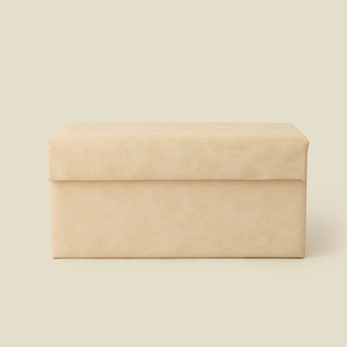 Cream vegan leather jewelry box with hinged lid, smooth faux leather finish.