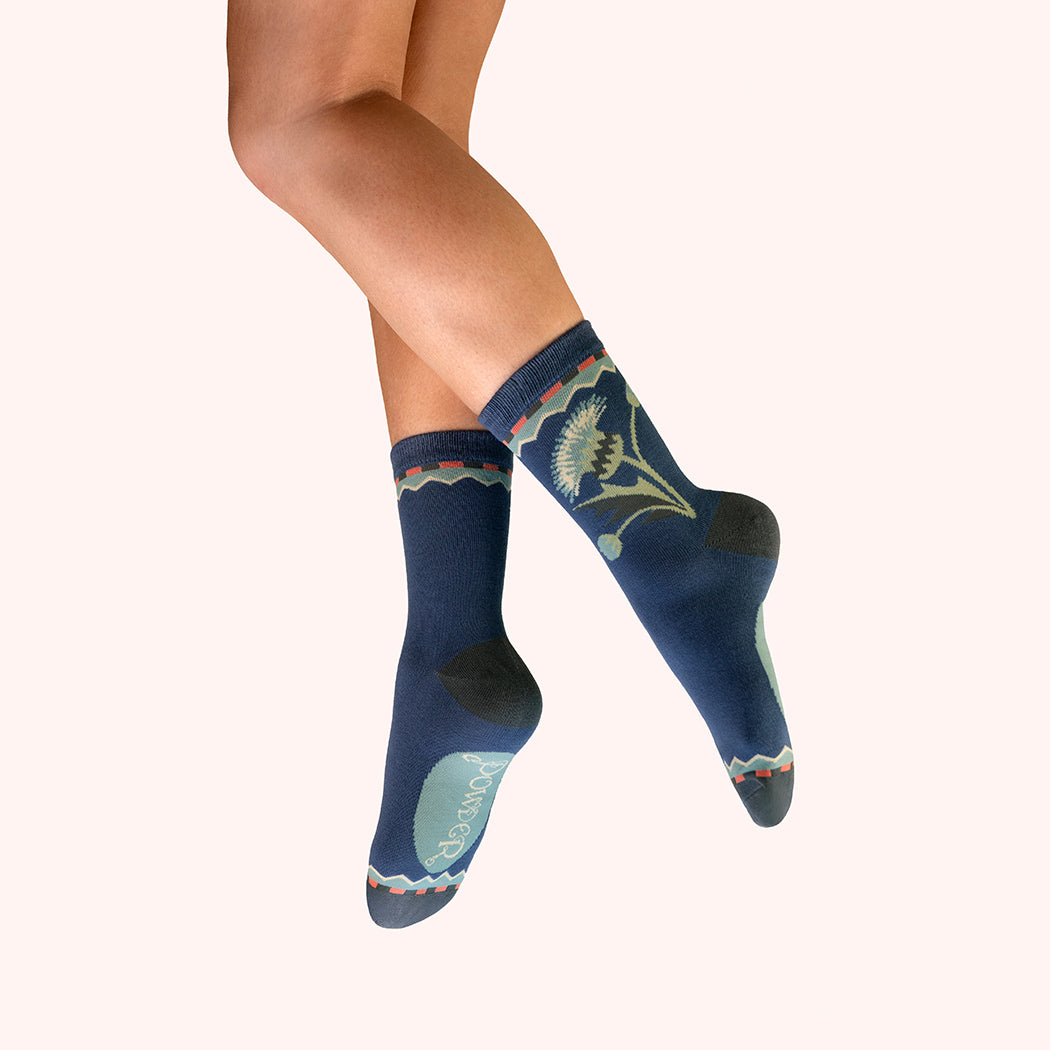 Dark blue ankle socks with green and yellow thistle pattern, ribbed cuff