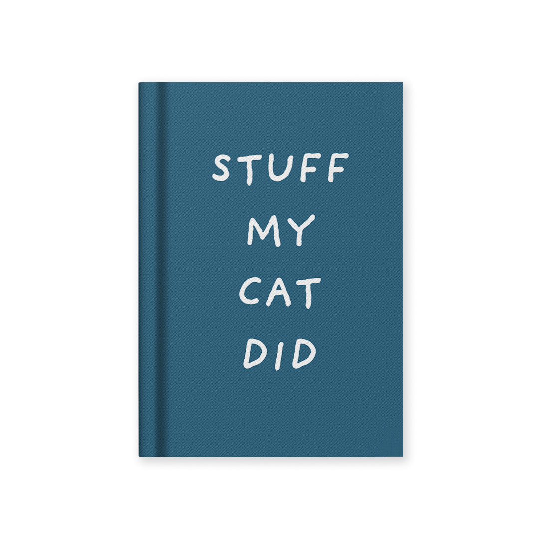 A7 hardback fabric notebook with teal cover and white 'STUFF MY CAT DID' lettering