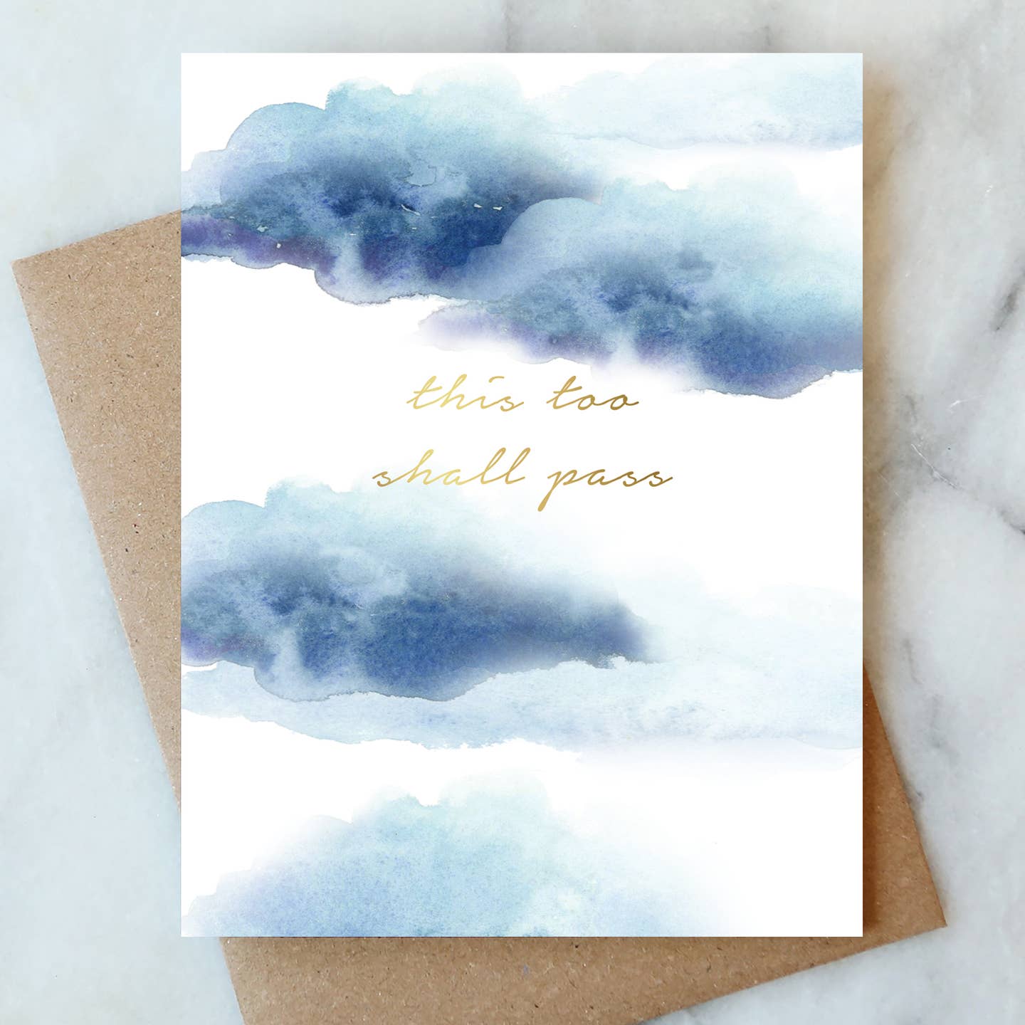 Sympathy greeting card with blue watercolor clouds and cursive message “this too shall pass”