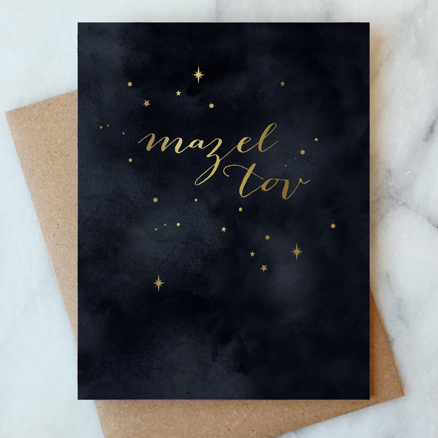 Dark starry night greeting card with gold "Mazel Tov" text and small star accents