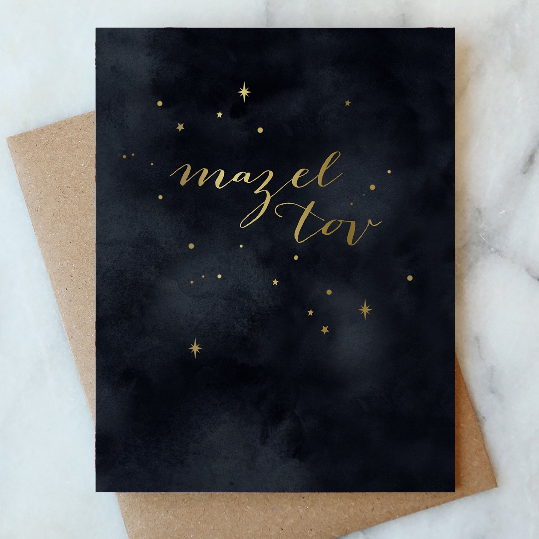 Dark starry night greeting card with gold "Mazel Tov" text and small star accents