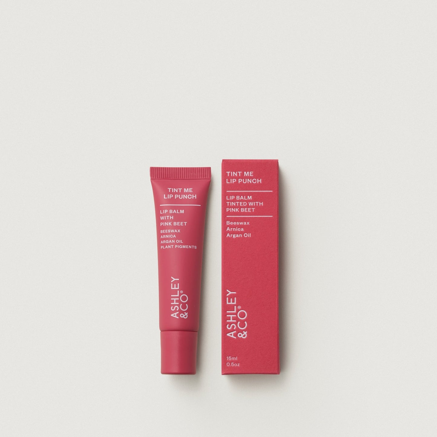Tint Me Lip Punch lip balm, pink beet pink tube