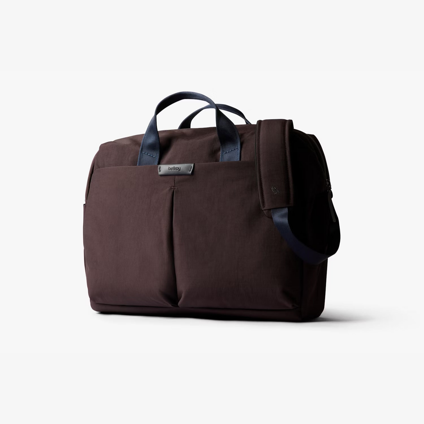 Deep plum work bag with top handles, front pocket, and adjustable side strap