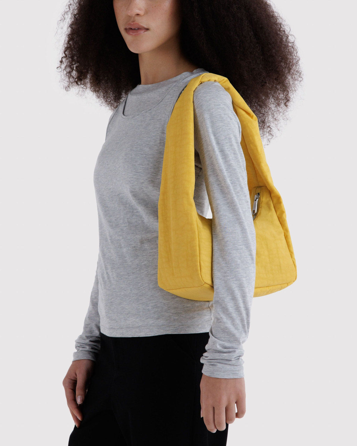Yellow small nylon meringue bag worn across the shoulder