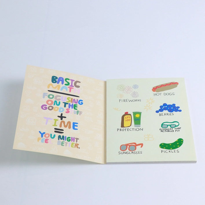 Open sticker book pages with colorful words and small illustrated sticker icons