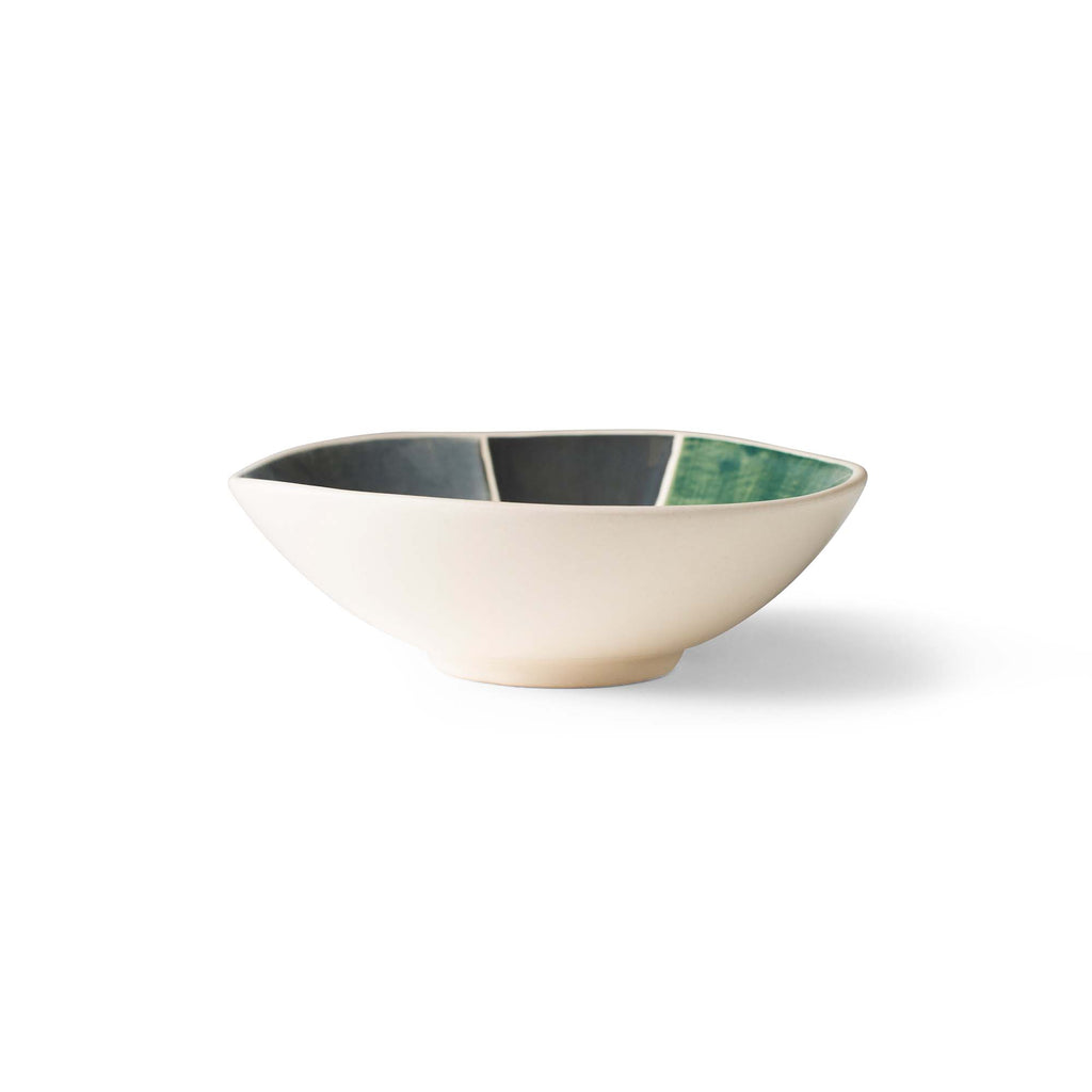 Round serving bowl with white exterior and dark green inner rim detail.