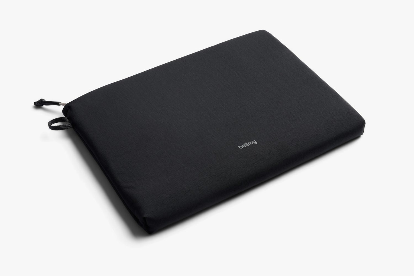 Black laptop sleeve with drawstring tie and padded fabric, slim profile