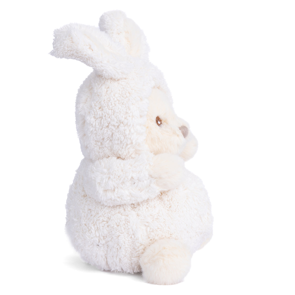 Cream plush bunny side view with floppy ears, stitched face, and cuddly body