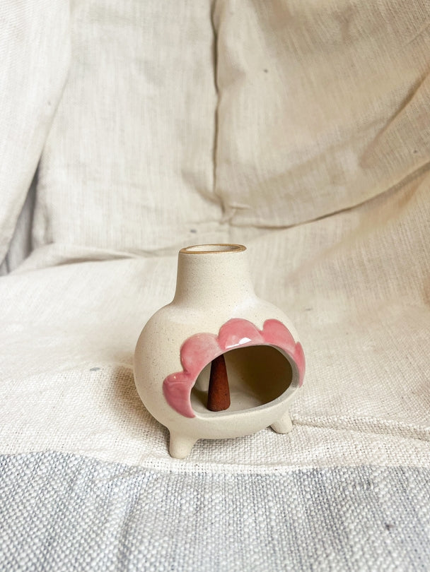 Pink ceramic incense chimney burner with heart petal cutout and small flame