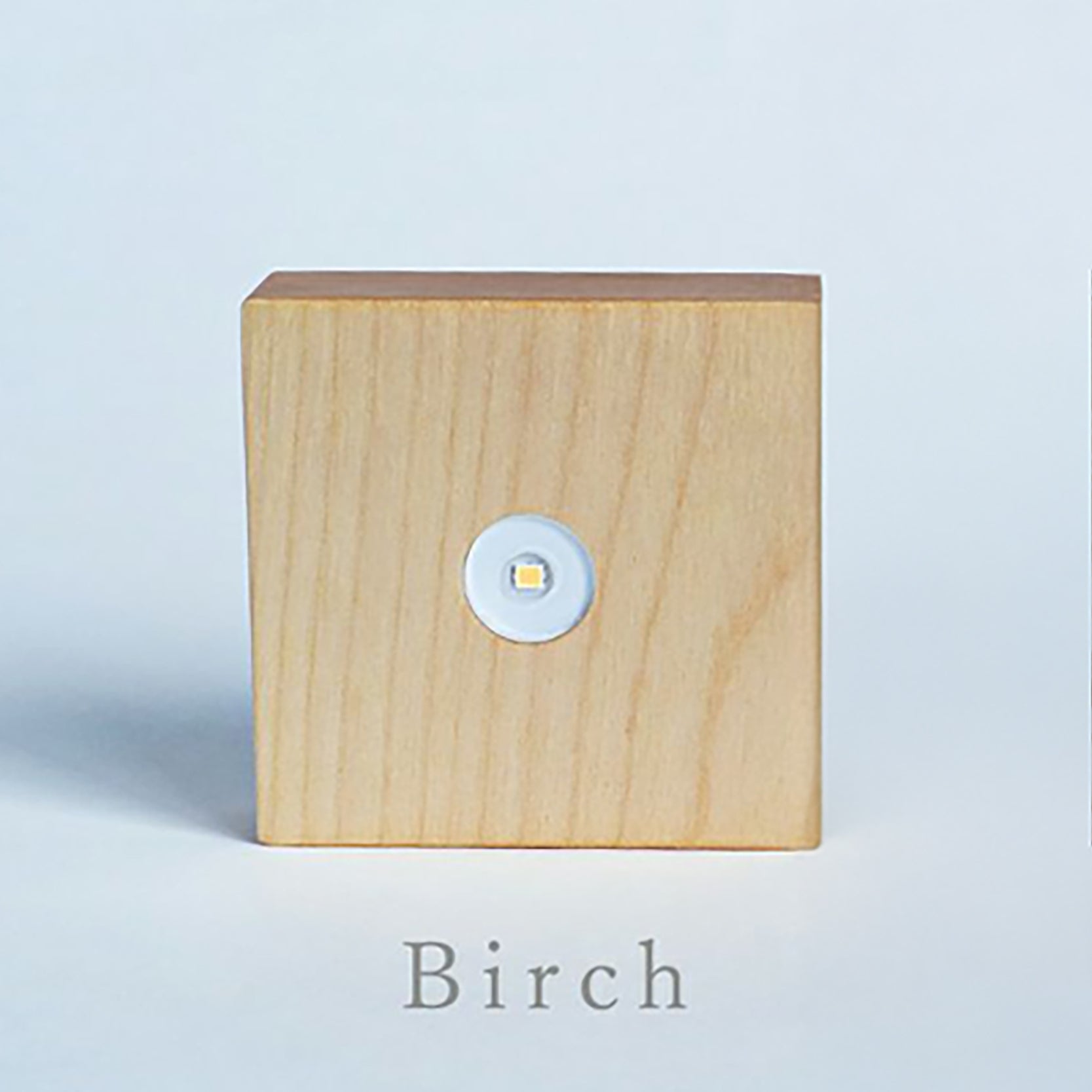 Birch wood cube light base with round LED button and clear top