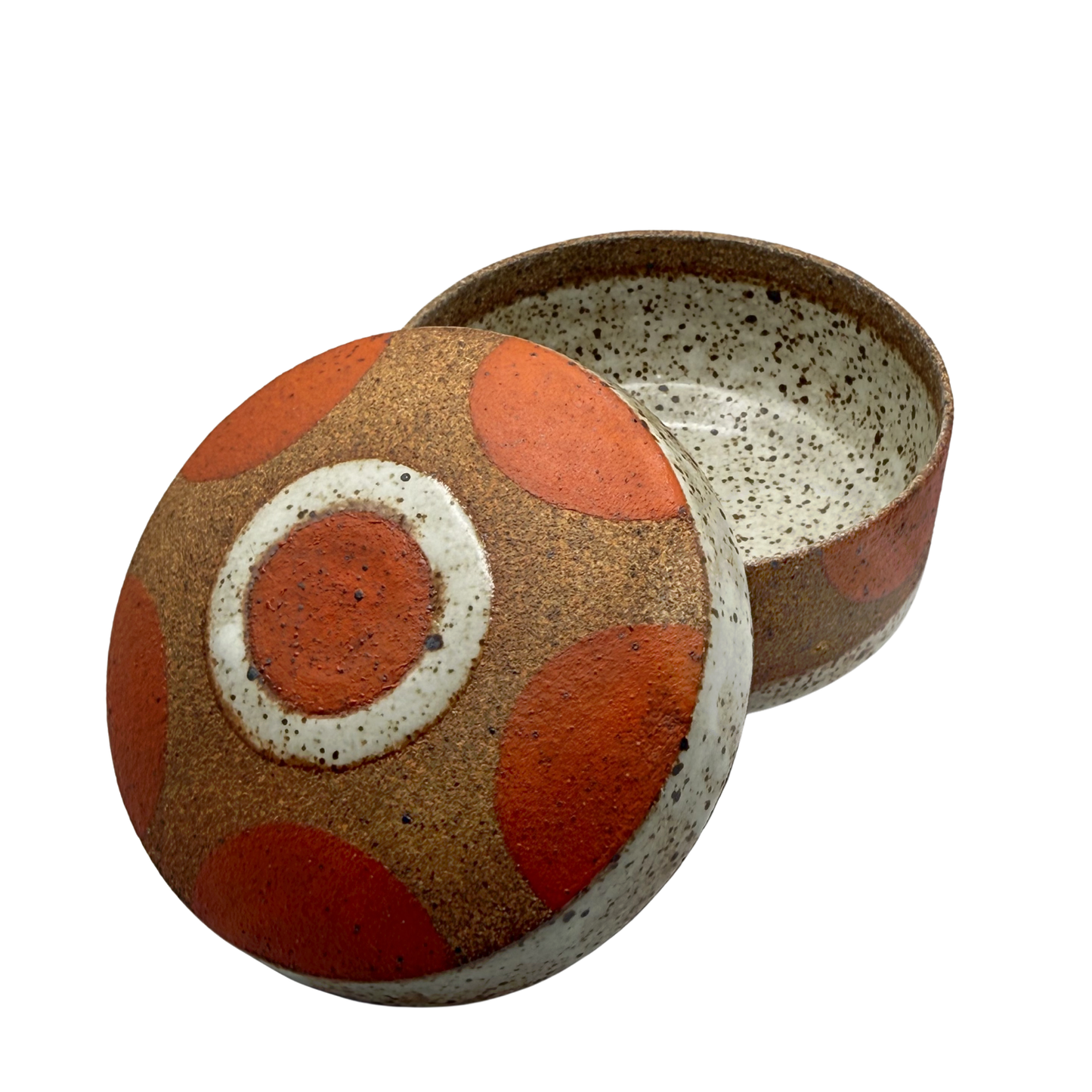 Lidded jar with orange circle motif, speckled white interior and matching lid