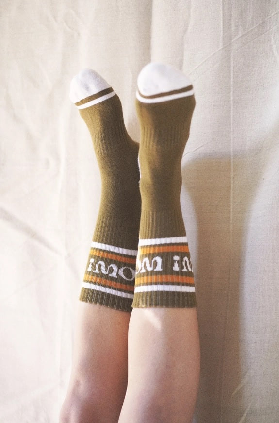 Olive crew socks with white top cuff stripes and striped band