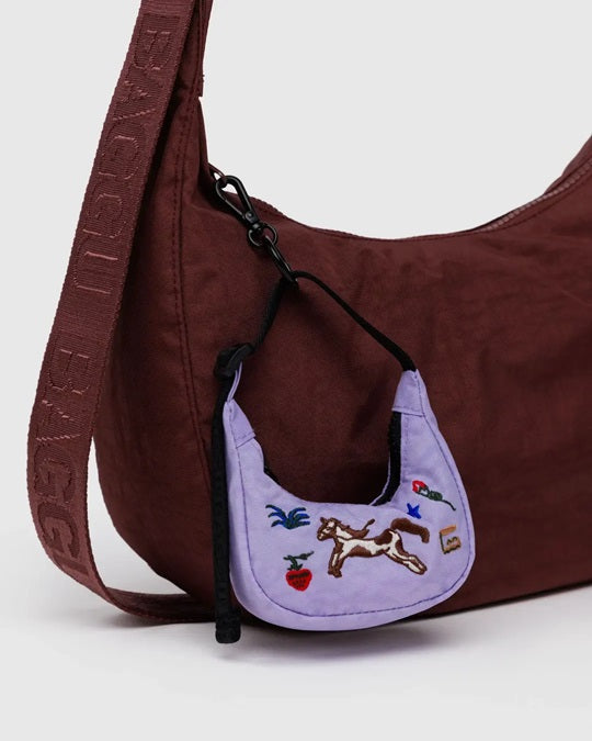 Purple embroidered crescent bag charm with black drawstring loops