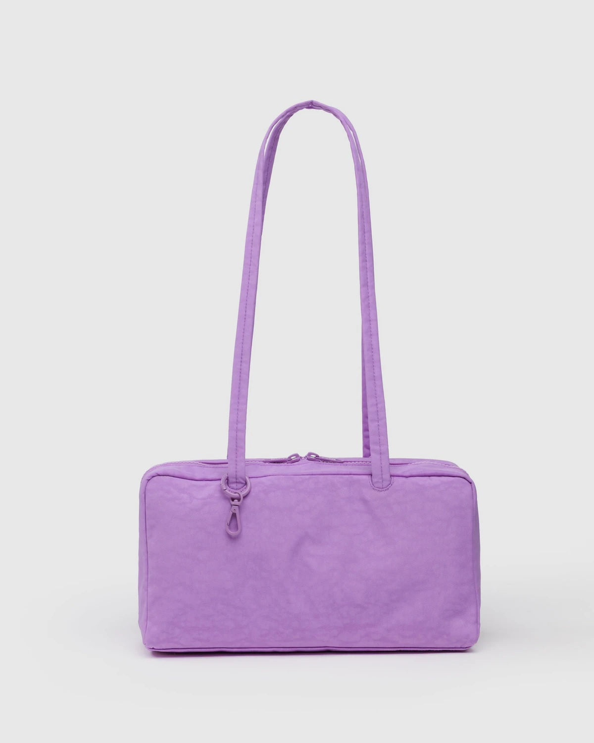 Nylon bowler bag in light purple with two top handles and zipper closure.
