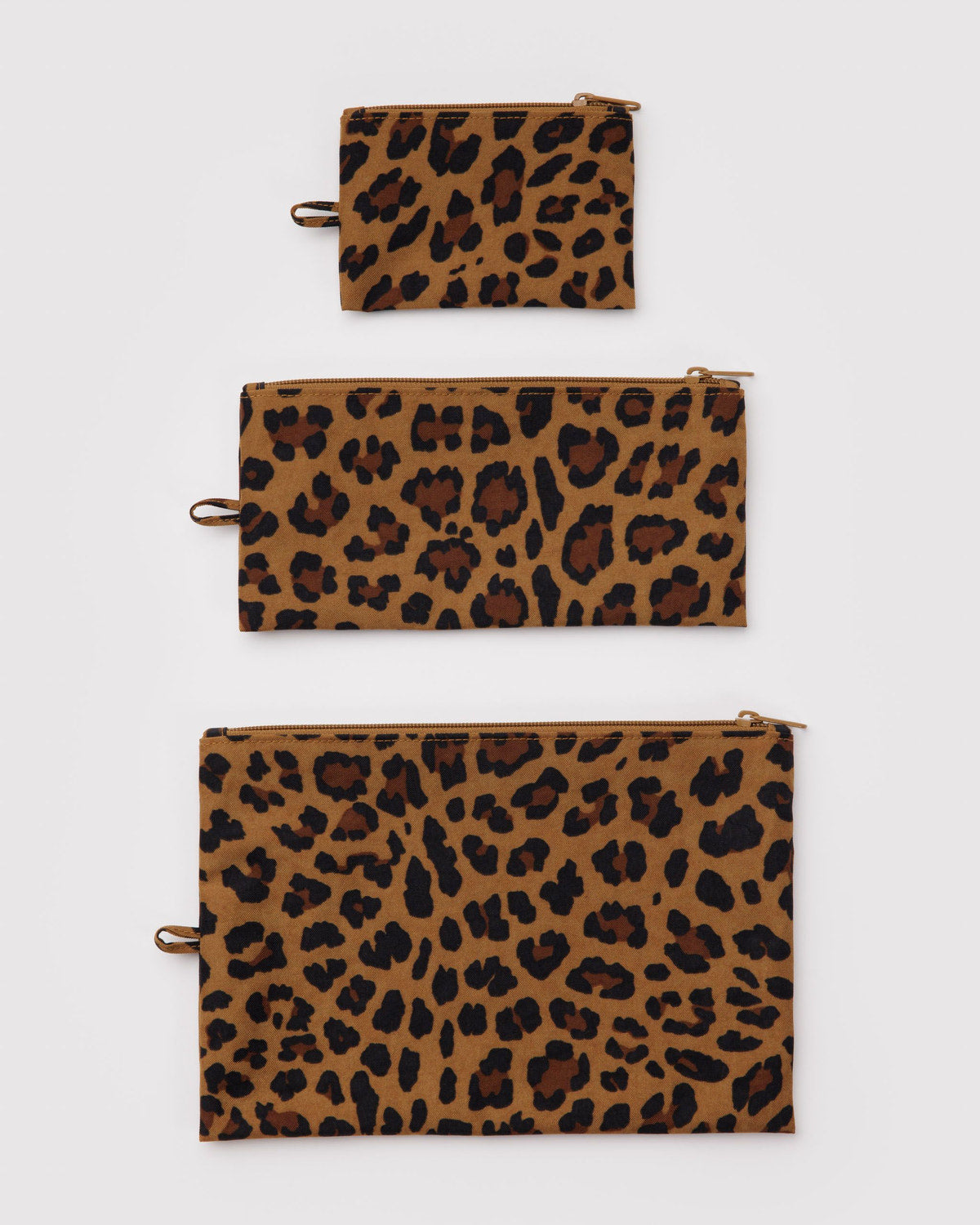 Set of three flat zipper pouches with leopard print and metal zipper pull tabs