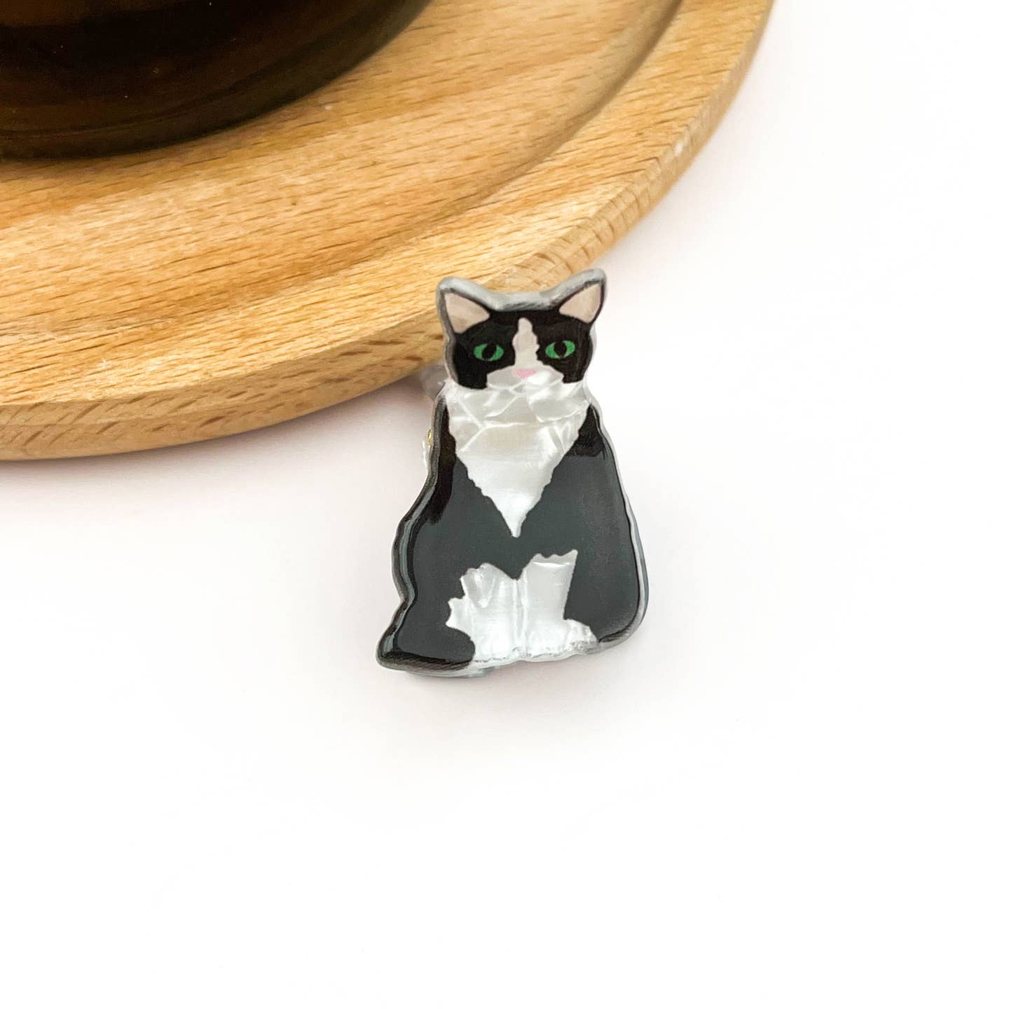 Mini cat hair claw with tuxedo cat face, black and white, green eyes