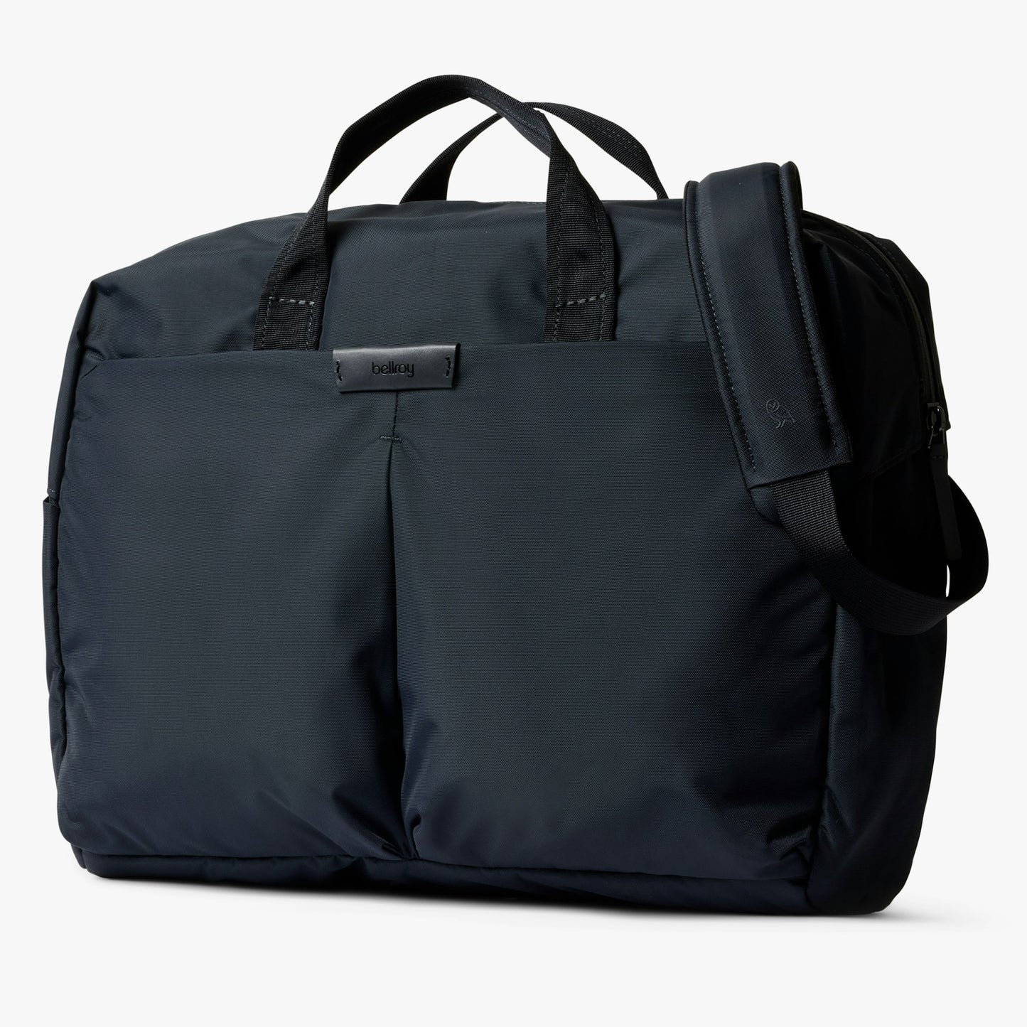 Navy work bag with top handles, front pocket, and attached shoulder strap