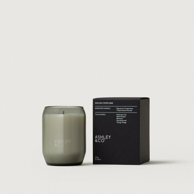 Waxed perfume candle in smoky olive glass jar with black scent box