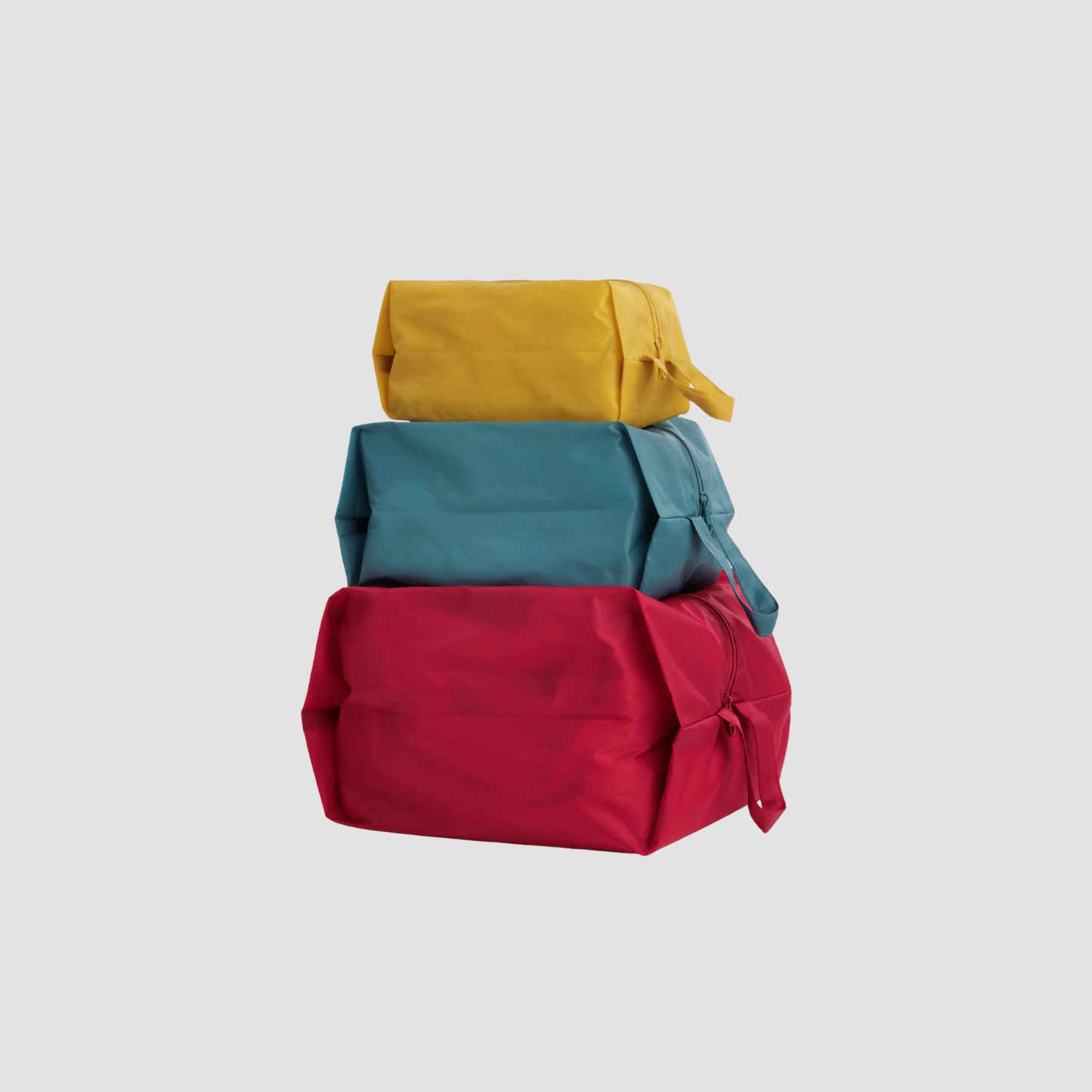 3D zip set with teal, yellow, and red solid fabric pouches