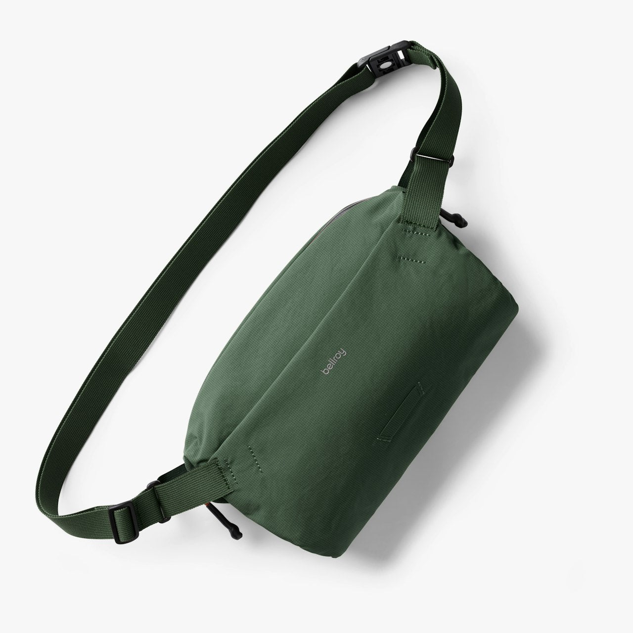 Green Lite sling bag with adjustable strap and zip front pocket
