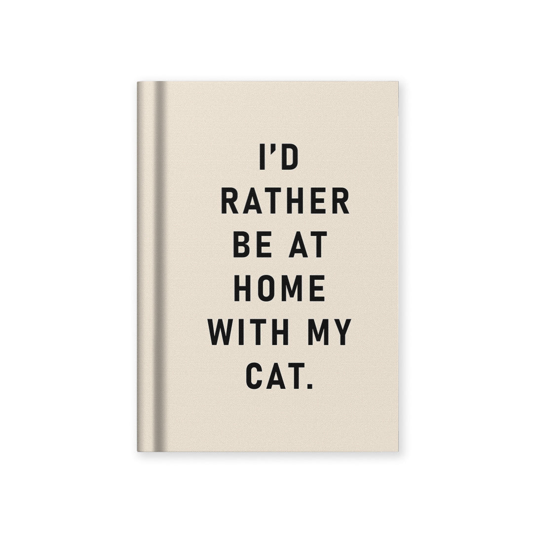 Beige hardback fabric notebook with black cat-themed quote text