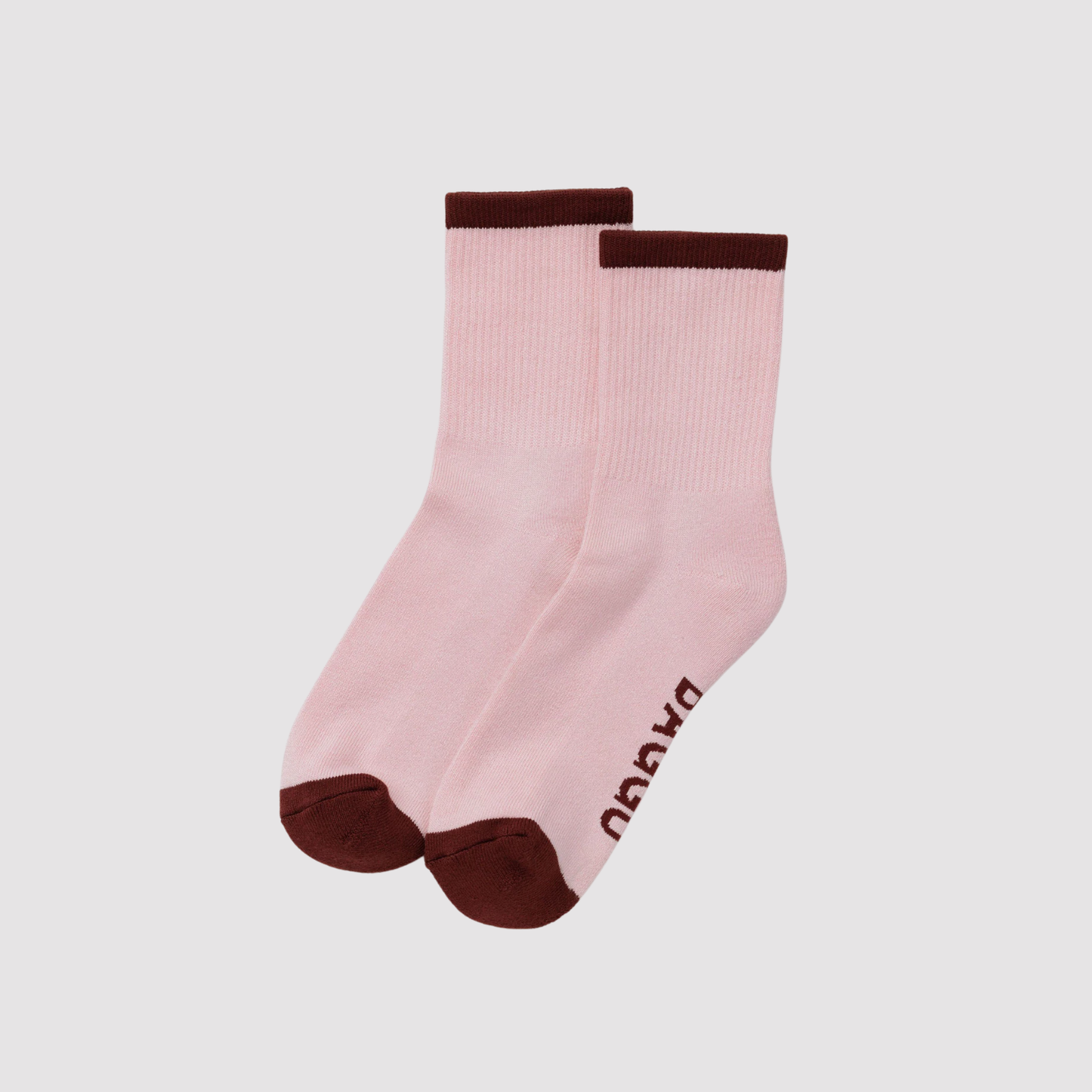 Ribbed socks in blush pink with dark cuff, paired with rounded toe.