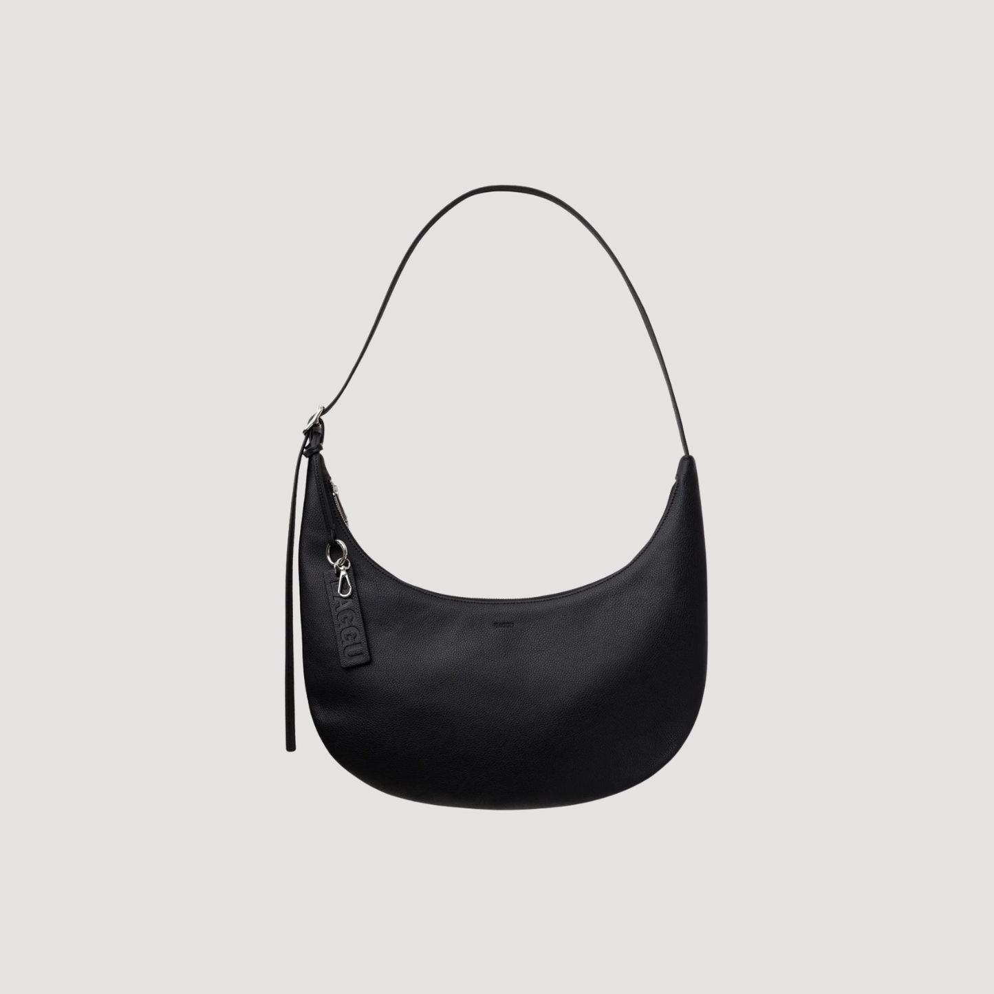 Medium crescent hobo bag in black recycled leather, zip top and hanging tassel