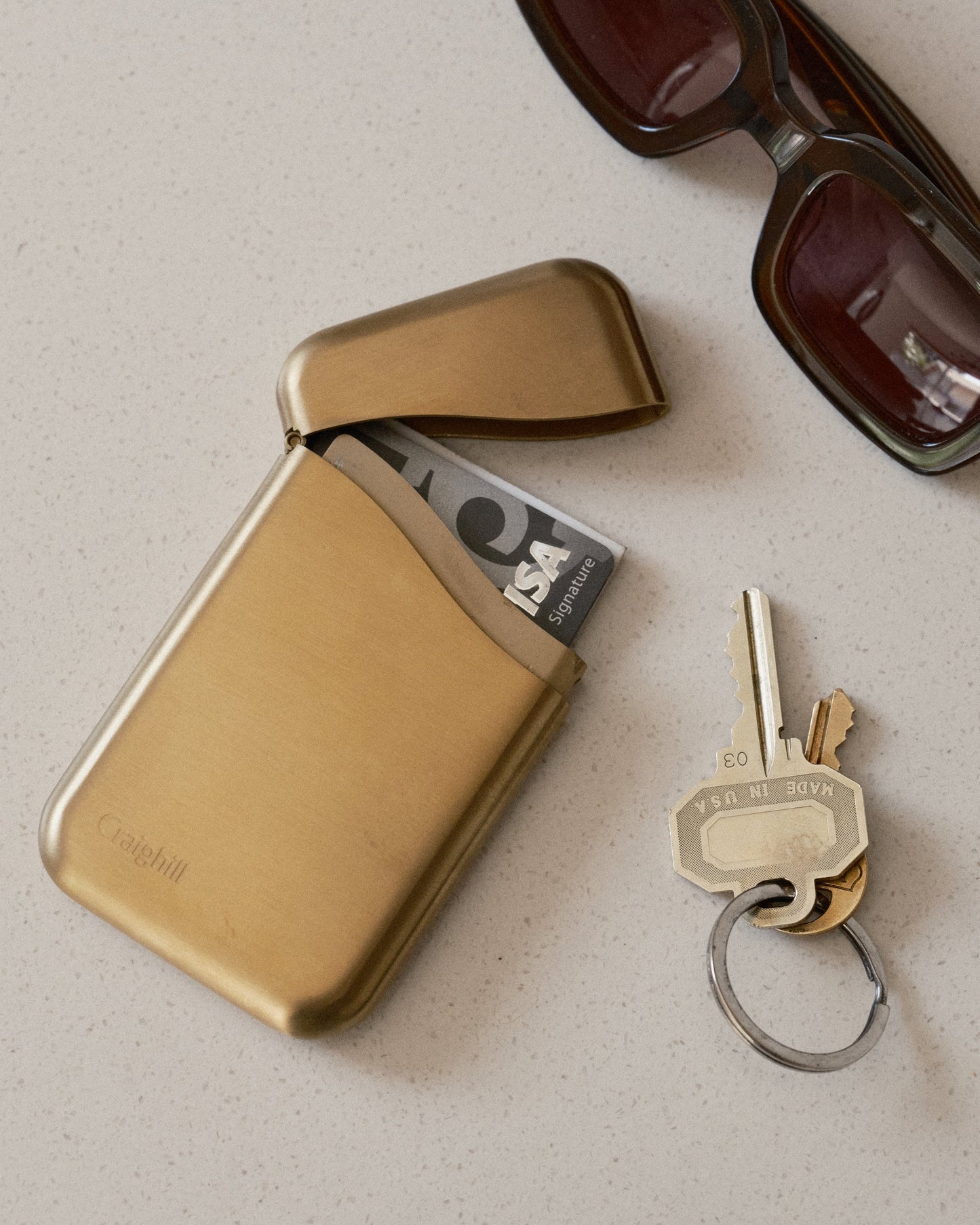 Vapor brass Summit card case open with card slots and foldover flap