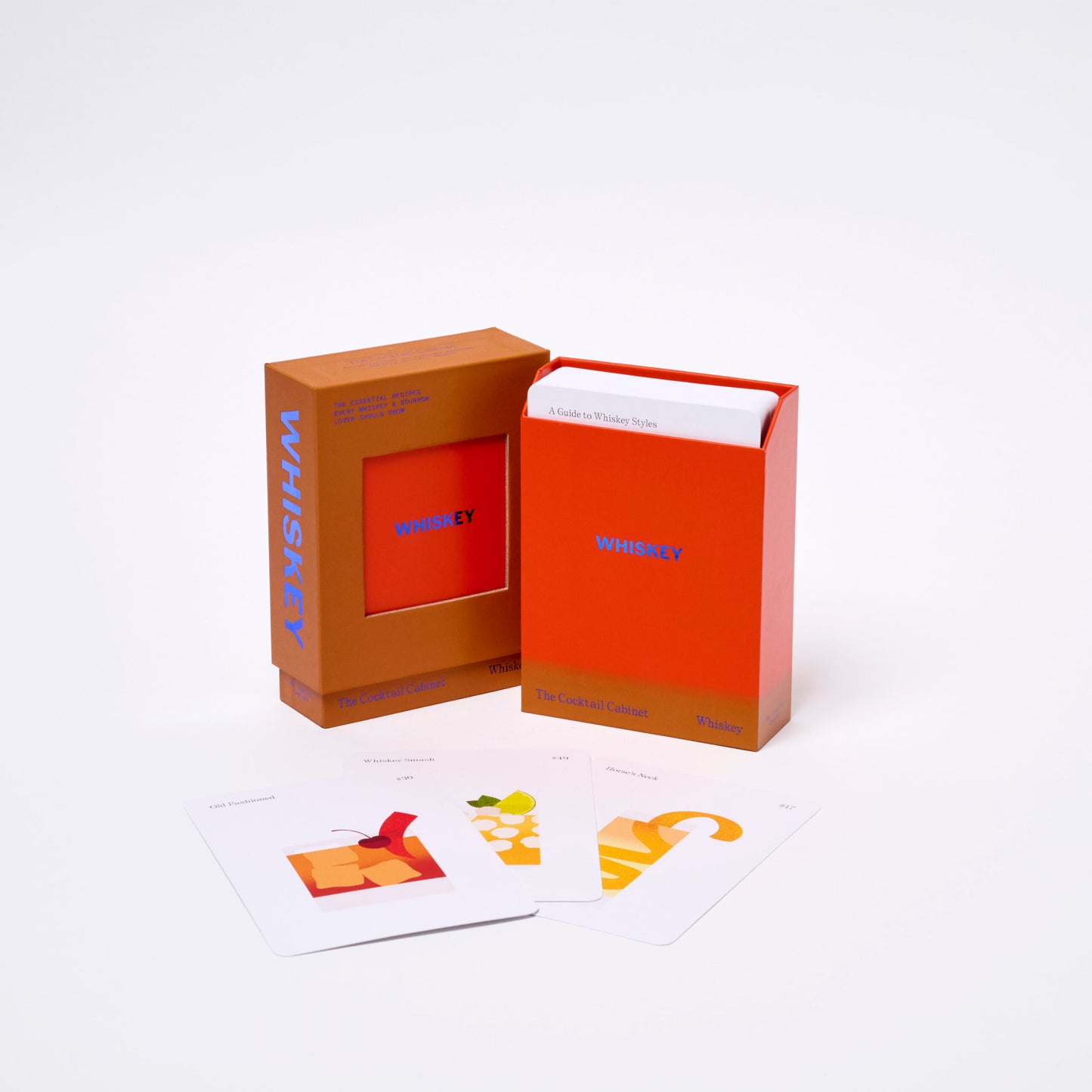 Whiskey cocktail cabinet packaging with cards and open orange box